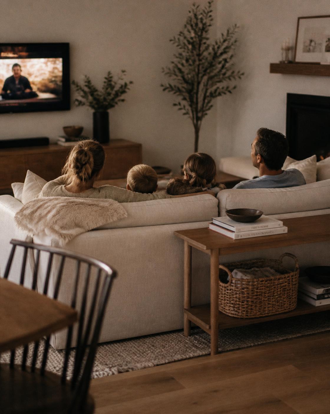 A family relaxing together in a calm, clean living room